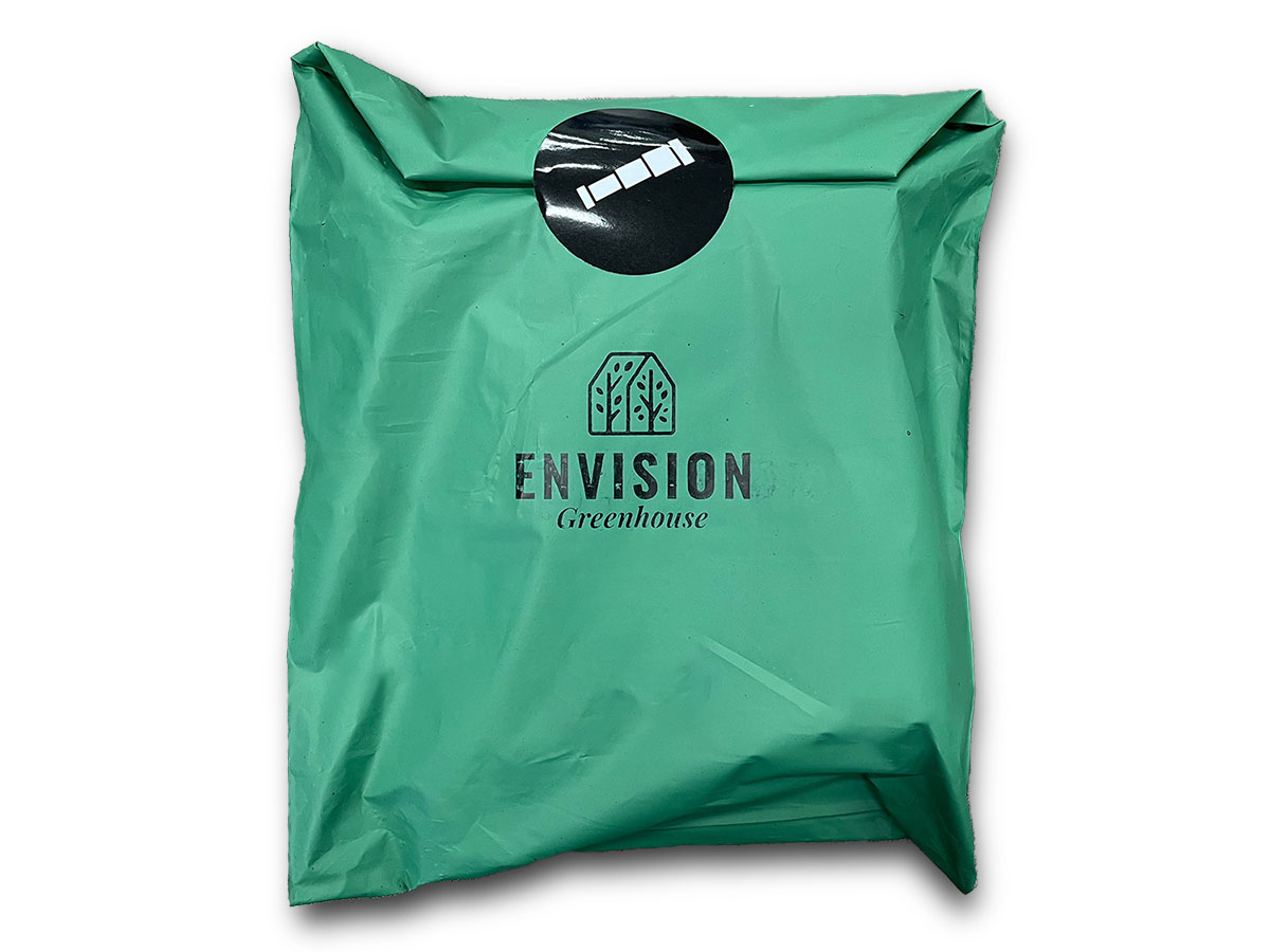 Envision Greenhouse Packaging. A green polymailer bag with a greenhouse stamp on it.